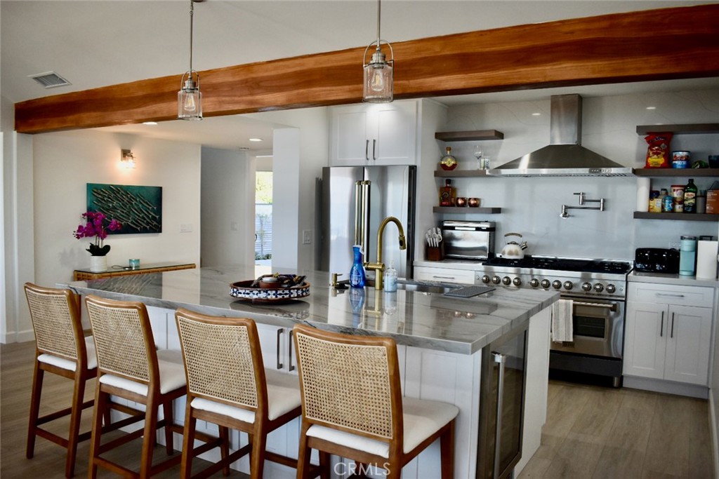 35605 Beach Road Dana Point, CA 92624 - Photo 14 of 61 a kitchen with stainless steel appliances granite countertop a stove a sink and a refrigerator