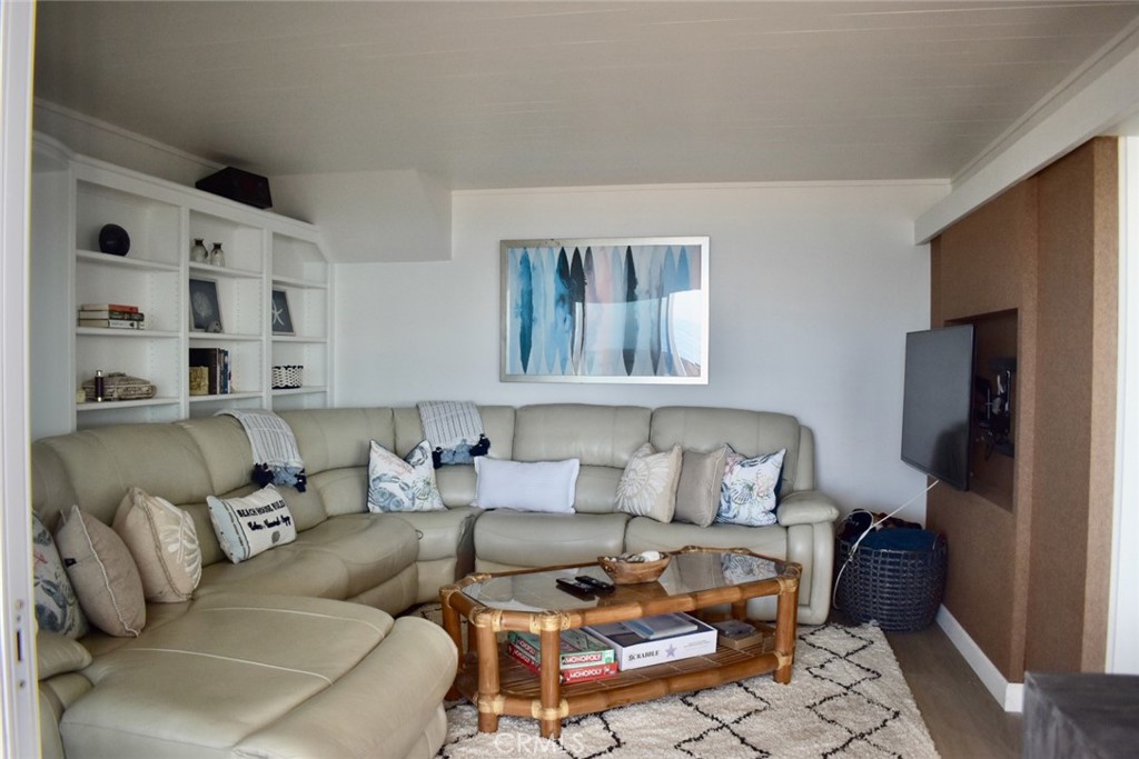 35605 Beach Road Dana Point, CA 92624 - Photo 22 of 61 a living room with furniture and a flat screen tv