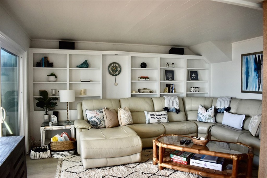 35605 Beach Road Dana Point, CA 92624 - Photo 23 of 61 a living room with furniture cabinets and a couch
