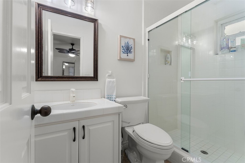 35605 Beach Road Dana Point, CA 92624 - Photo 29 of 61 a bathroom with a toilet sink and mirror
