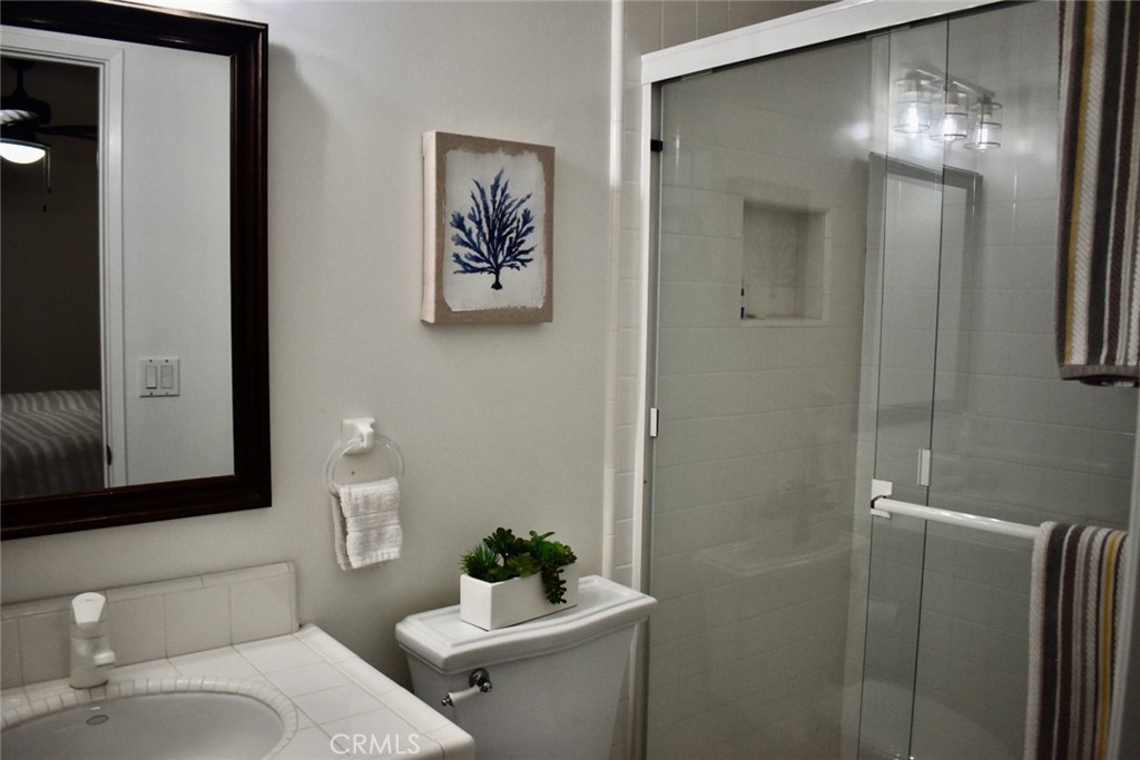 35605 Beach Road Dana Point, CA 92624 - Photo 30 of 61 a bathroom with a toilet sink and mirror