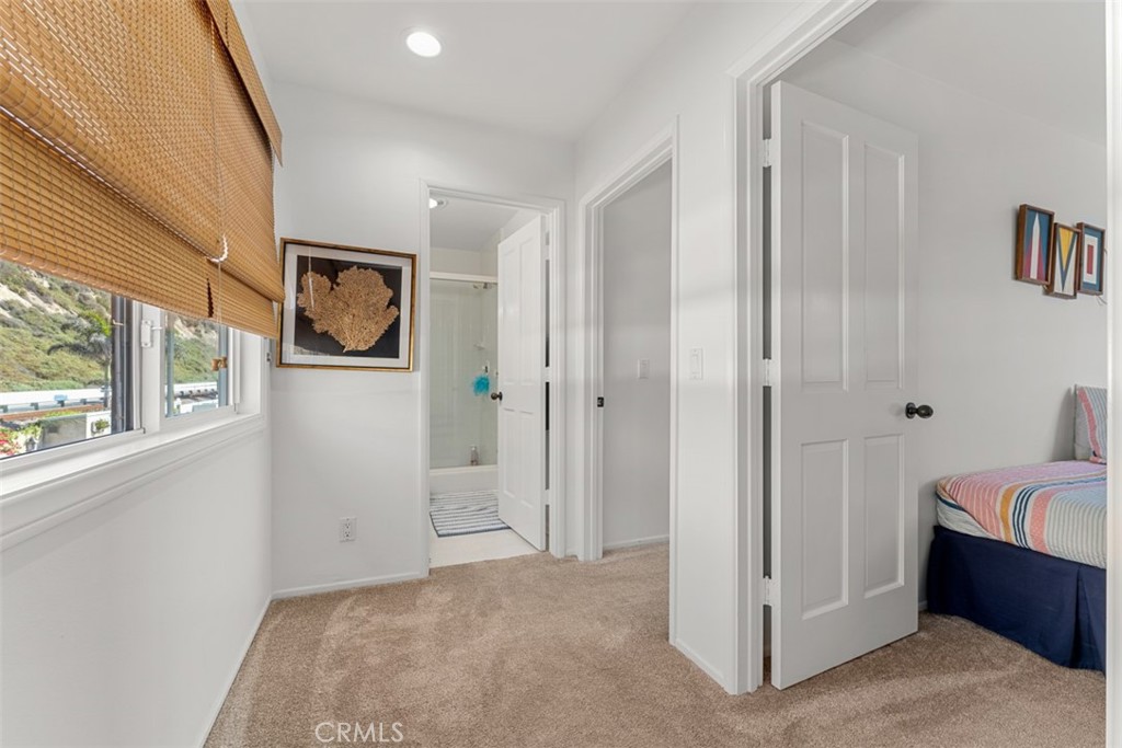 35605 Beach Road Dana Point, CA 92624 - Photo 38 of 61 a view of a bedroom with a bed and a window