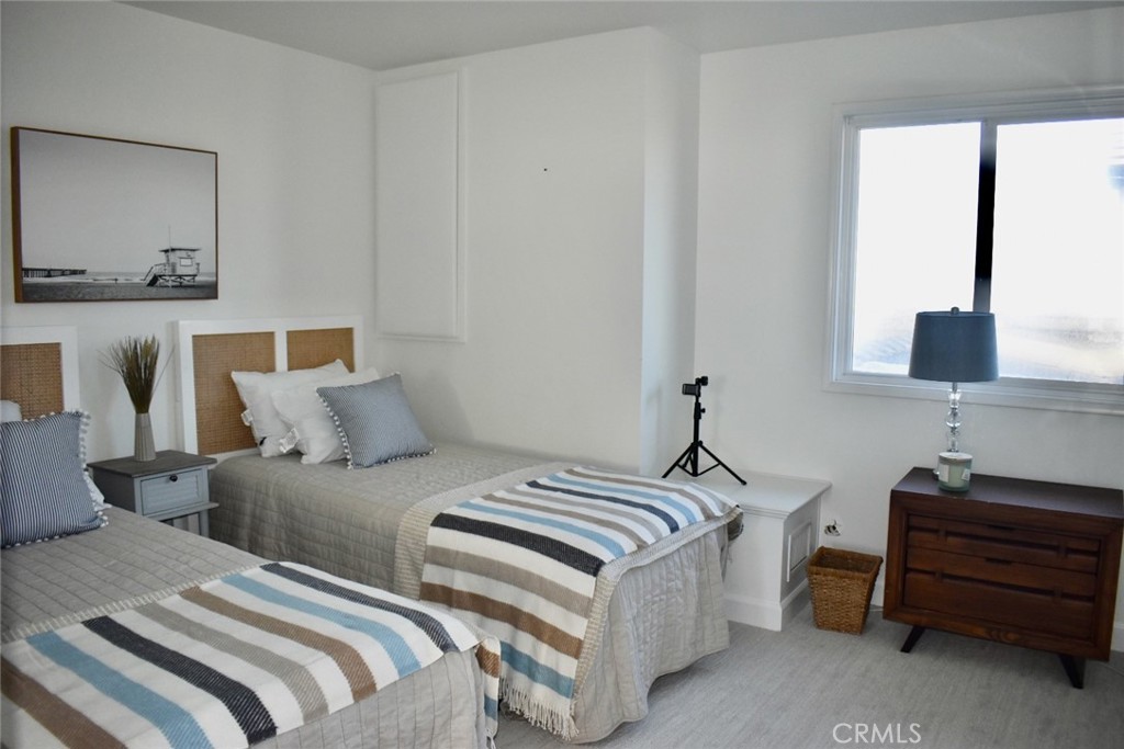 35605 Beach Road Dana Point, CA 92624 - Photo 40 of 61 a bedroom with a bed and a window