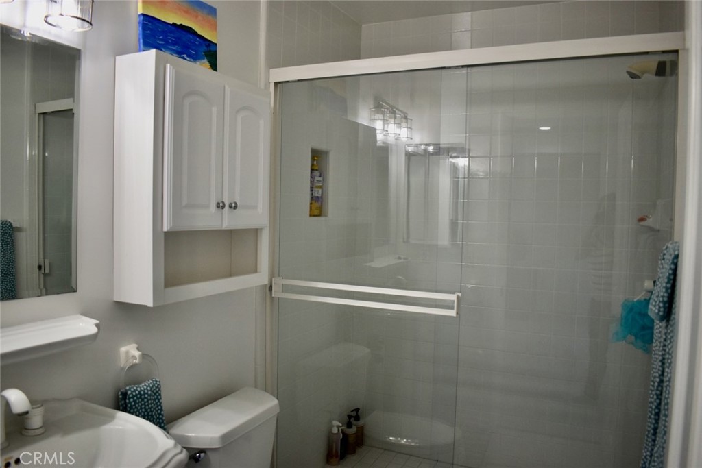35605 Beach Road Dana Point, CA 92624 - Photo 42 of 61 a bathroom with a shower and a toilet