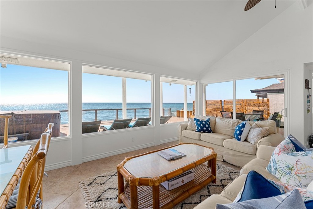 35605 Beach Road Dana Point, CA 92624 - Photo 8 of 61 a living room with furniture and floor to ceiling windows