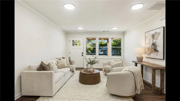 a living room with furniture and windows