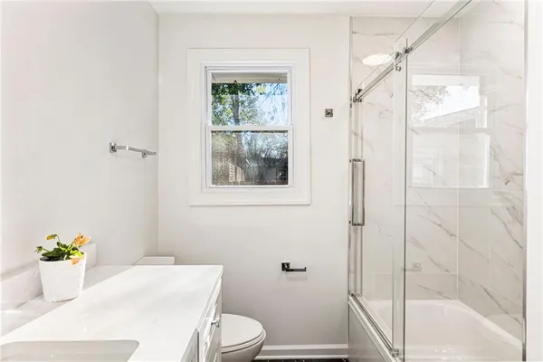a bathroom with a sink and toilet