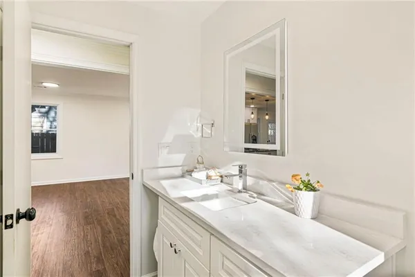a bathroom with a sink and a mirror
