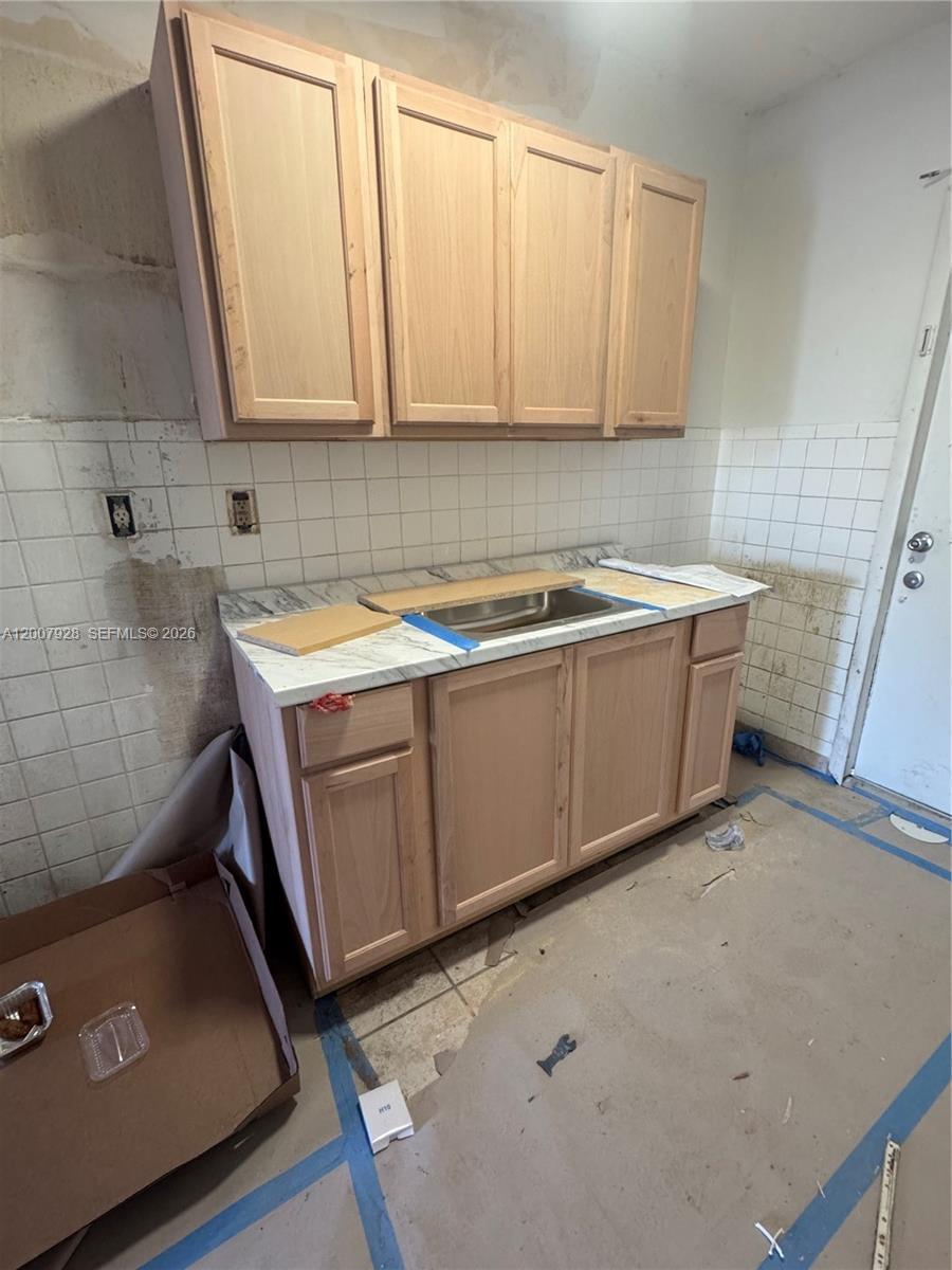 7300 Harding Avenue, Unit 6 Miami Beach, FL 33141 - Photo 2 of 6 a room with storage and utility