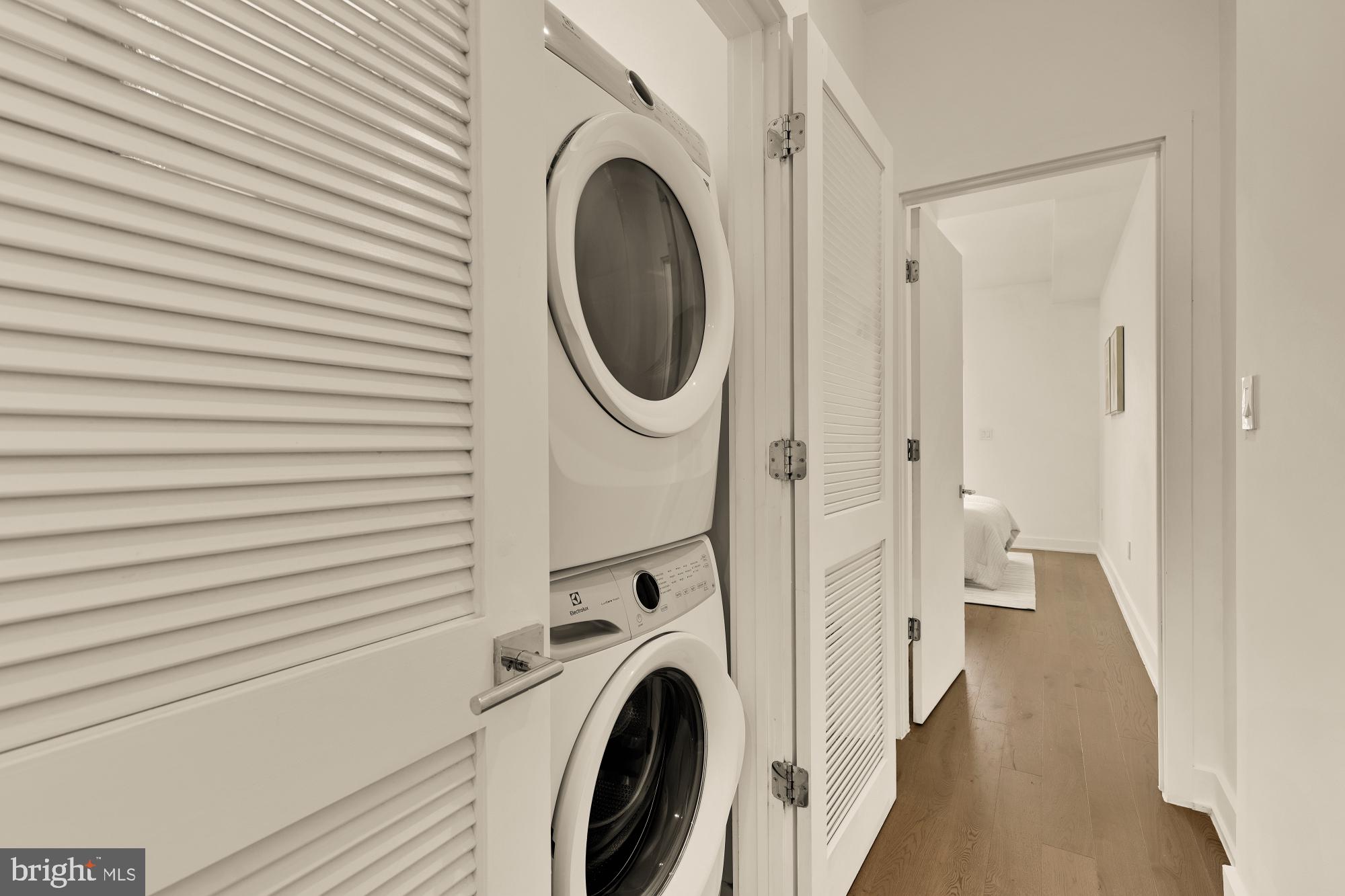 4017 Davis Place Northwest, Unit 8 Washington, DC 20007 - Photo 18 of 28 a view of a hallway with washer and dryer