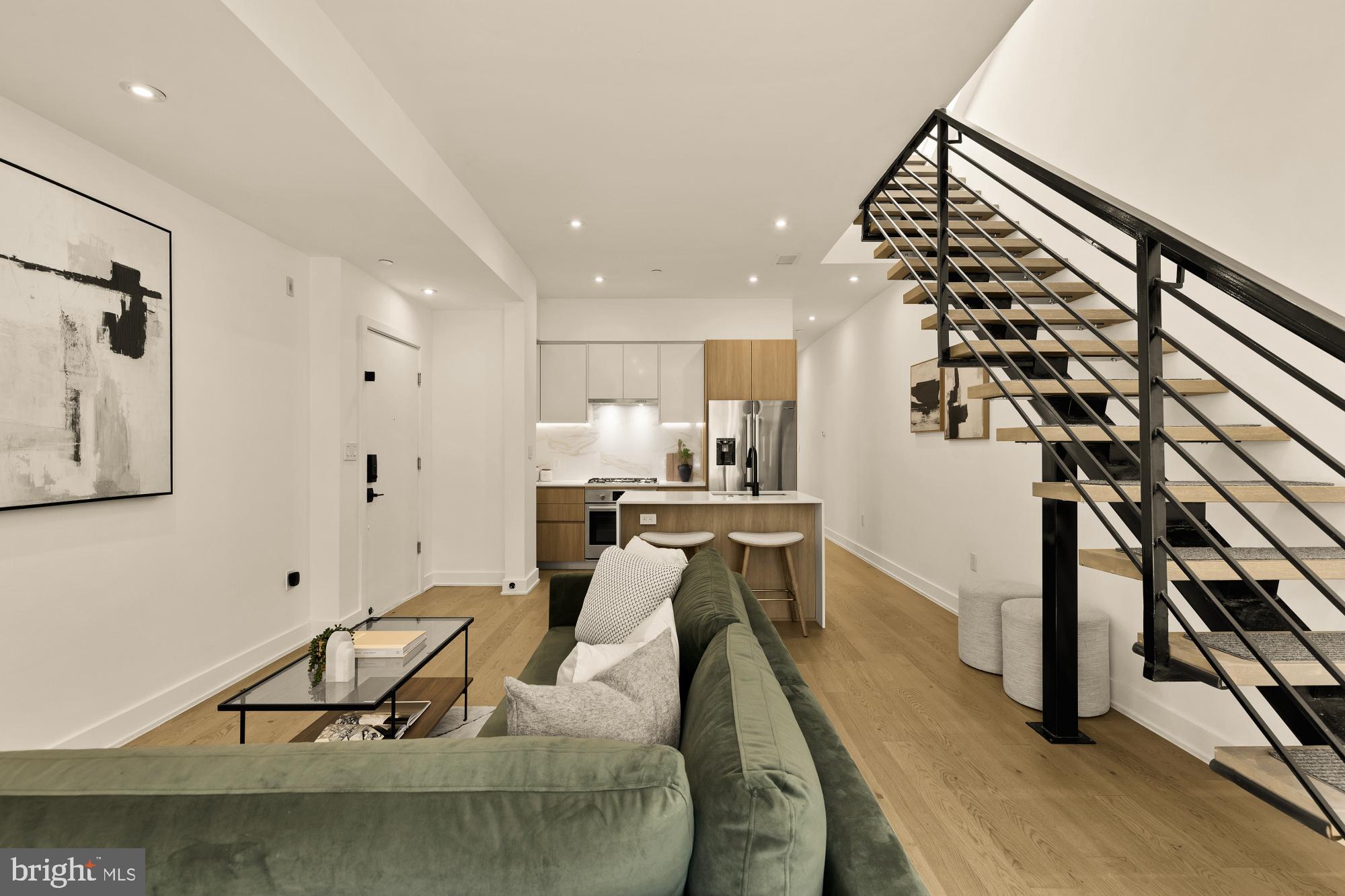 4017 Davis Place Northwest, Unit 8 Washington, DC 20007 - Photo 3 of 28 a living room with furniture and kitchen view