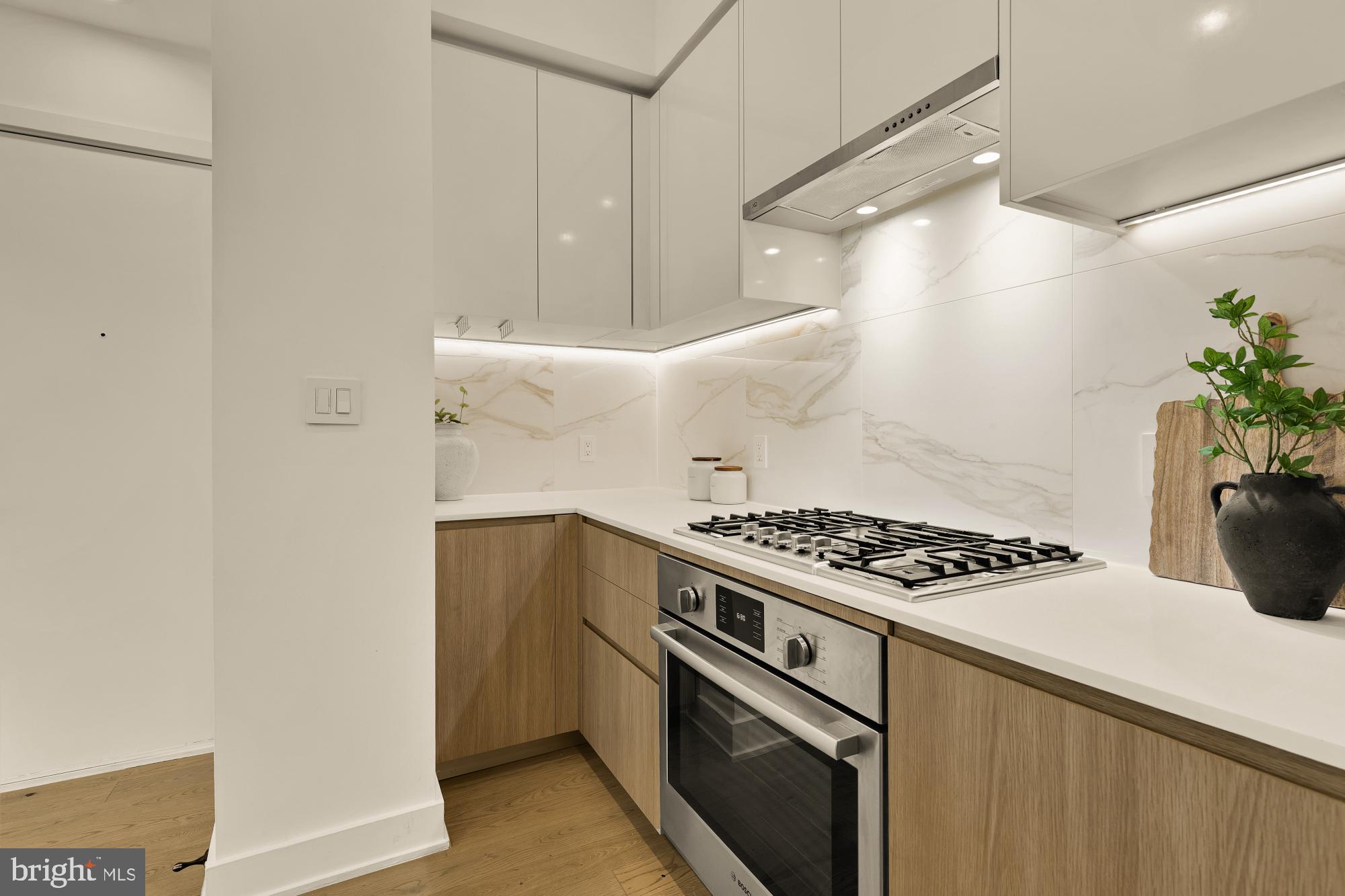 4017 Davis Place Northwest, Unit 8 Washington, DC 20007 - Photo 9 of 28 a kitchen with granite countertop a stove and a refrigerator