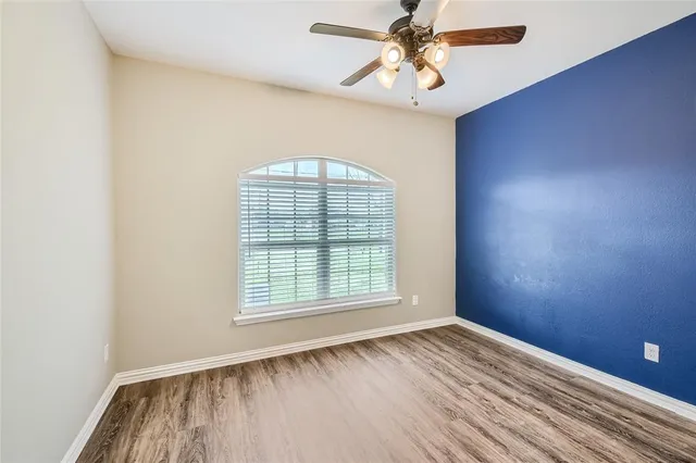 a bathroom with a shower and toilet