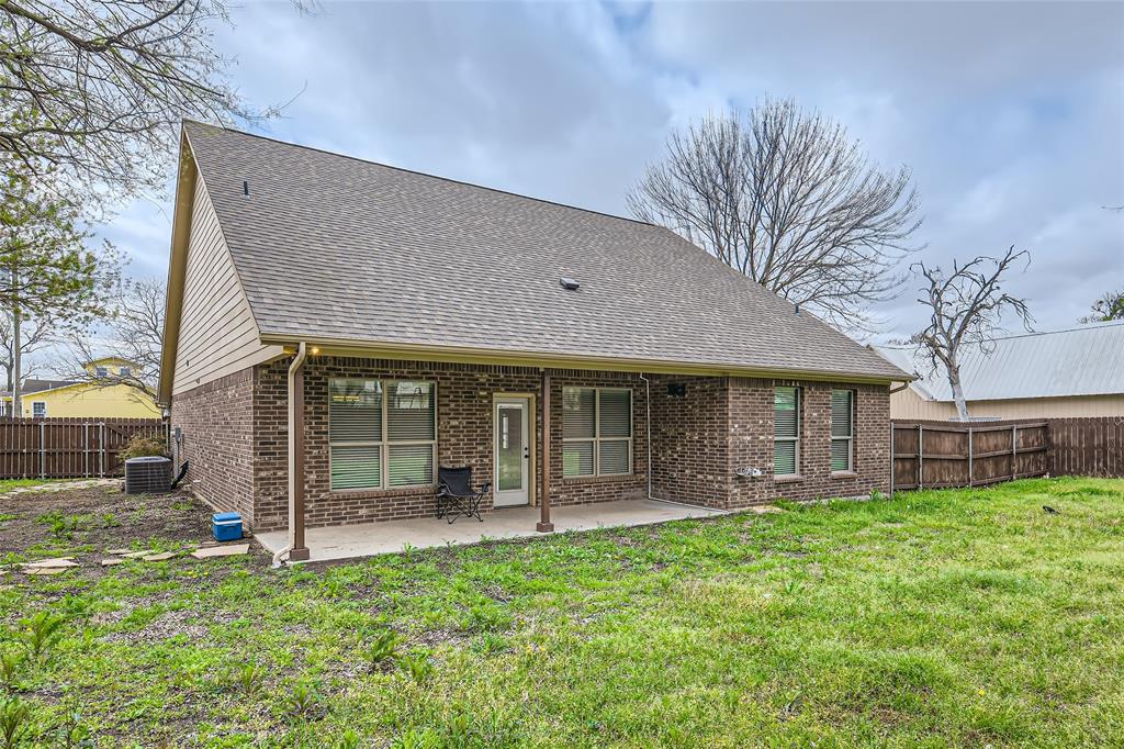 204 West Patton Street Alvarado, TX 76009 - Photo 16 of 17 a front view of a house with a garden