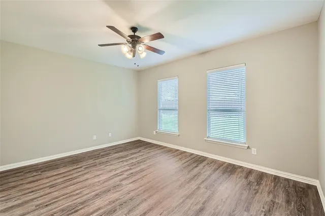 a kitchen with granite countertop a stove and a sink