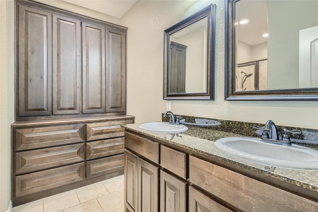 204 West Patton Street Alvarado, TX 76009 - Photo 9 of 17 a bathroom with a sink and a mirror