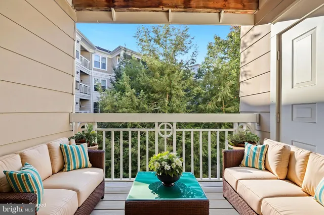 a balcony with outdoor seating