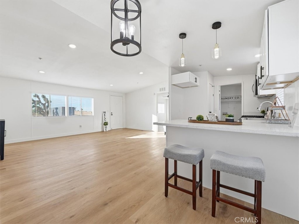 11878 Pacific Road Phelan, CA 92371 - Photo 13 of 50 a kitchen with stainless steel appliances granite countertop a kitchen island a stove a cabinets and a chairs