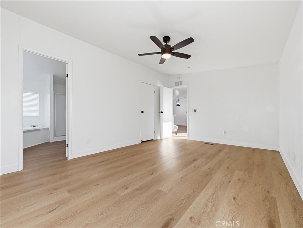 11878 Pacific Road Phelan, CA 92371 - Photo 17 of 50 a view of an empty room and wooden floor