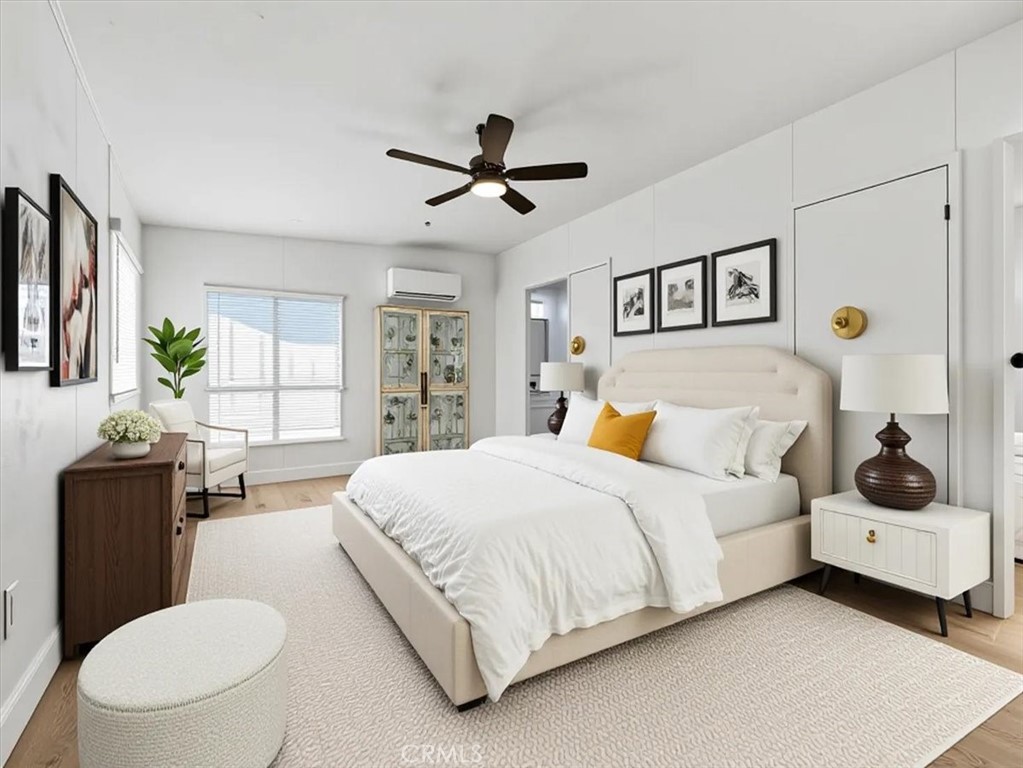 11878 Pacific Road Phelan, CA 92371 - Photo 19 of 50 a spacious bedroom with a bed a couch and a window