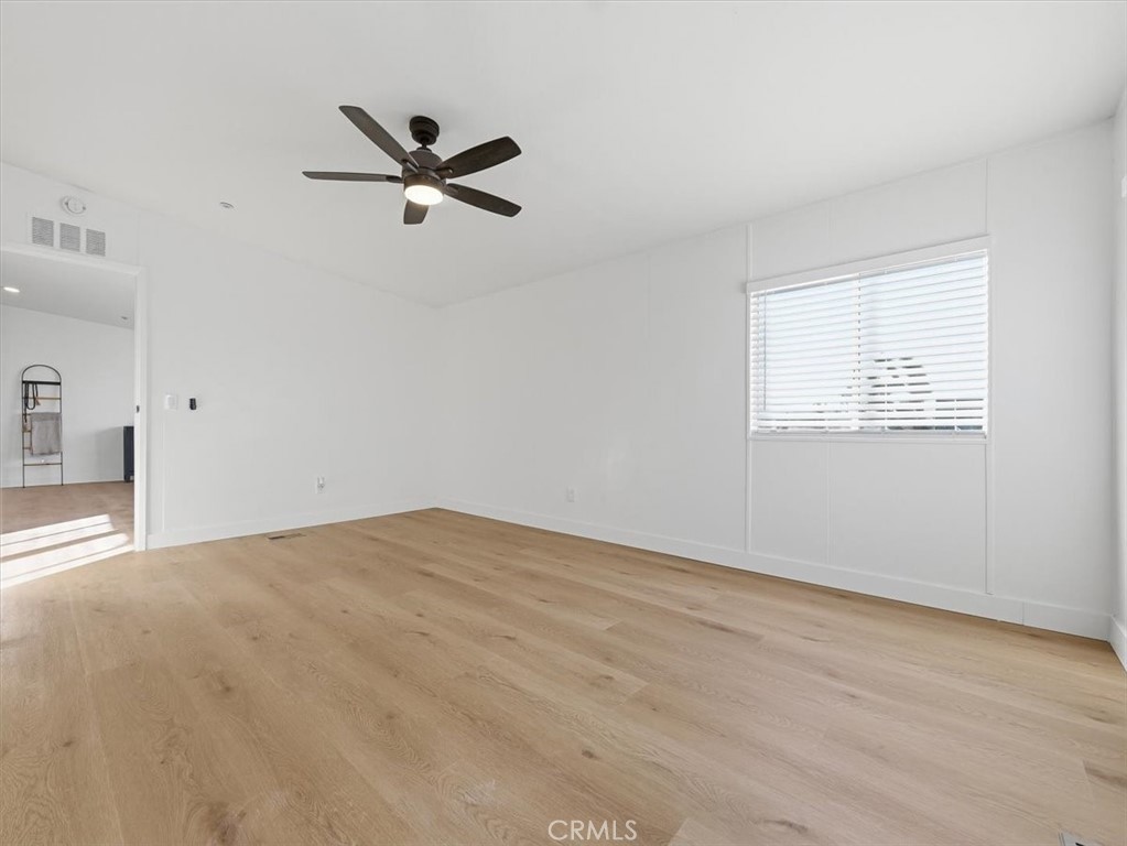 11878 Pacific Road Phelan, CA 92371 - Photo 20 of 50 a view of empty room with ceiling fan