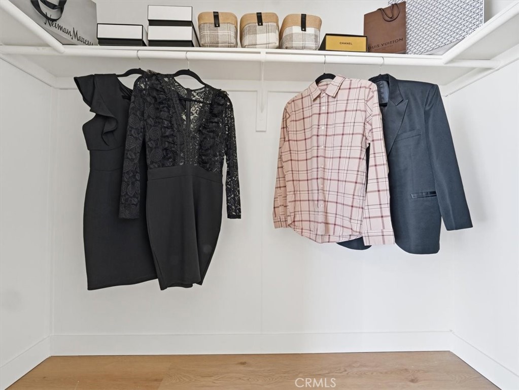 11878 Pacific Road Phelan, CA 92371 - Photo 21 of 50 a view of walk in closet with clothes and shoes