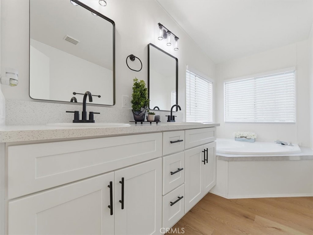 11878 Pacific Road Phelan, CA 92371 - Photo 24 of 50 a bathroom with a double vanity sink mirror and a