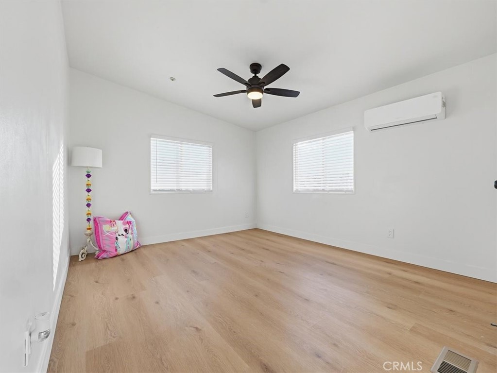 11878 Pacific Road Phelan, CA 92371 - Photo 28 of 50 a bedroom with furniture and window