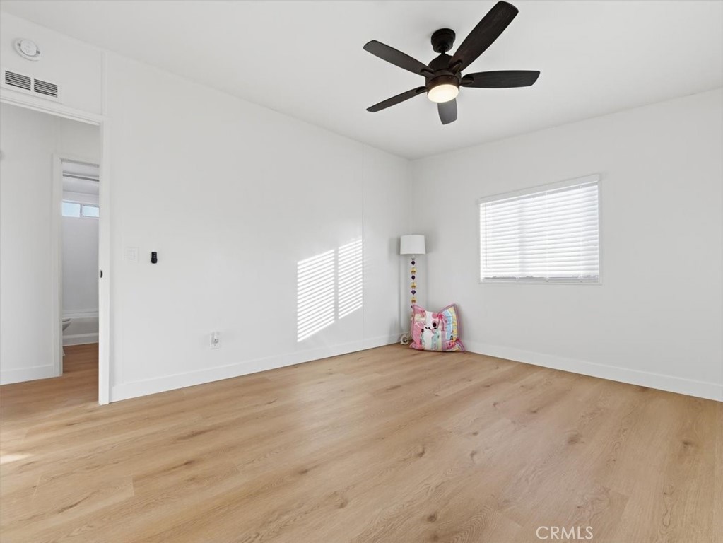 11878 Pacific Road Phelan, CA 92371 - Photo 30 of 50 wooden floor in an empty room with a window