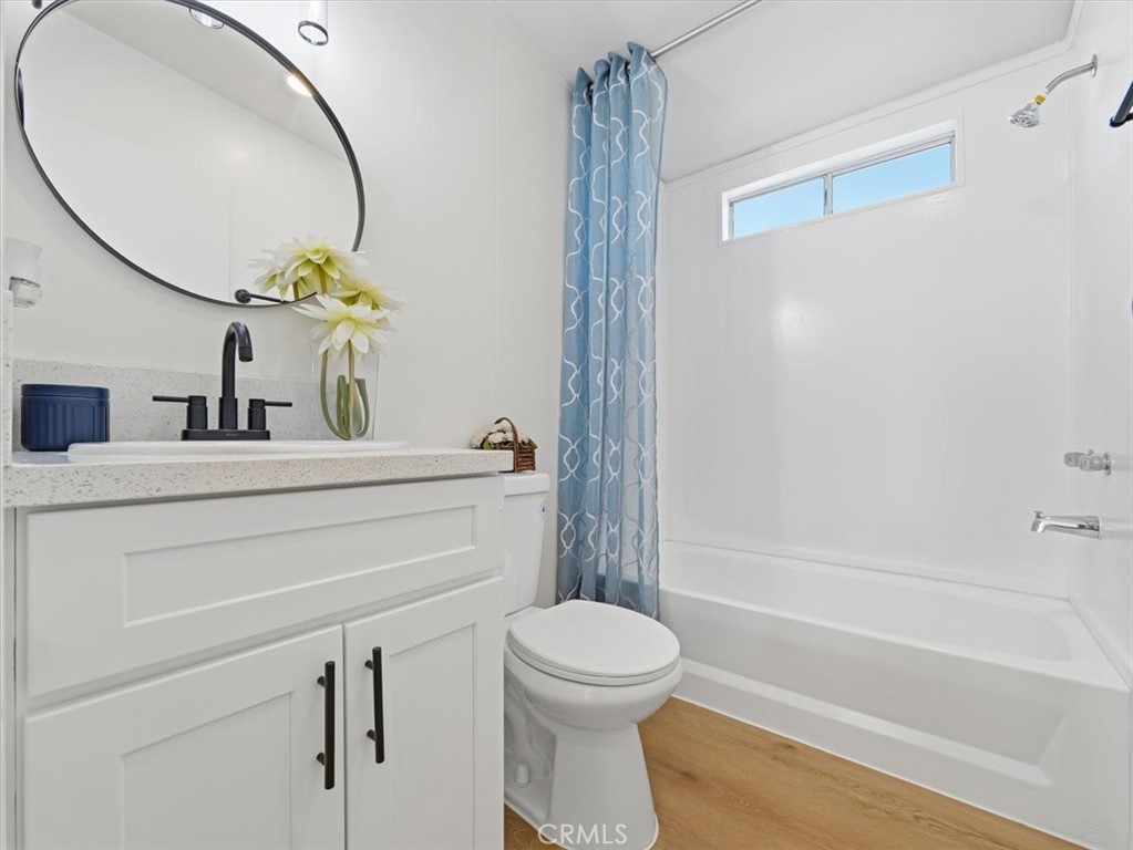 11878 Pacific Road Phelan, CA 92371 - Photo 31 of 50 a bathroom with a sink mirror vanity and toilet
