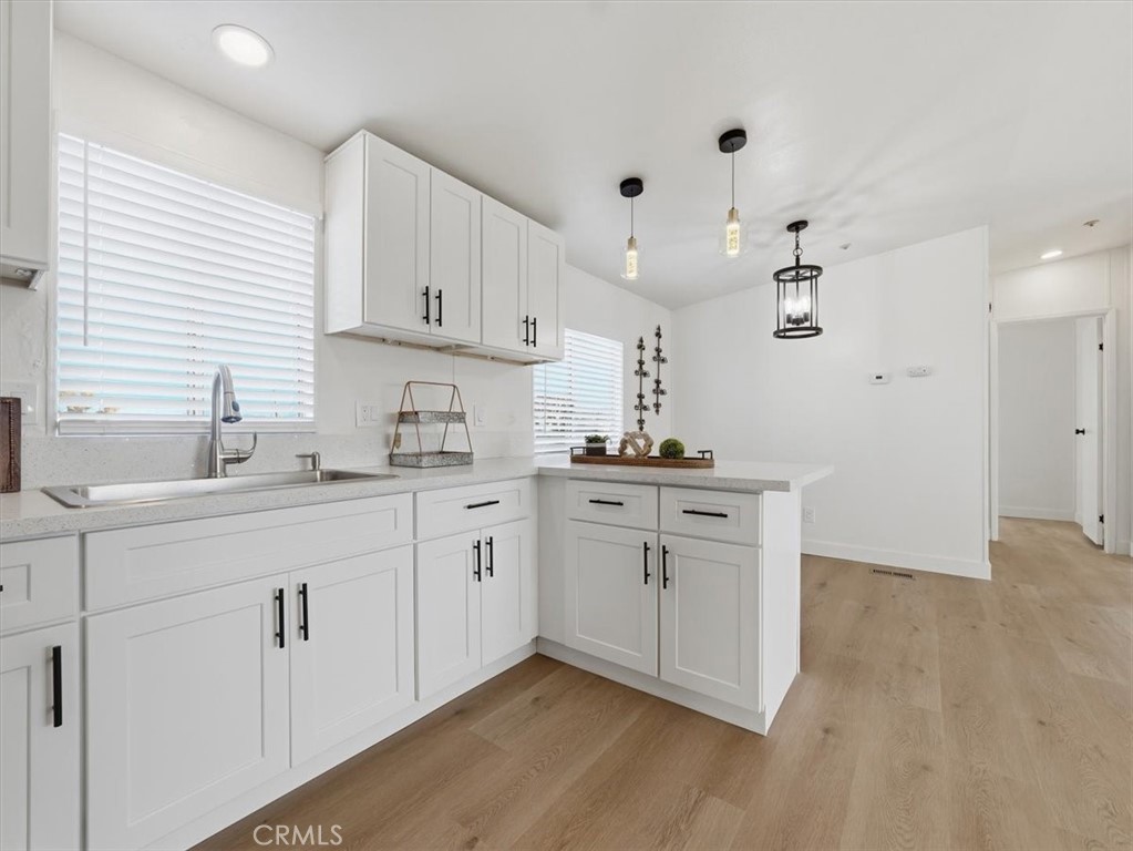 11878 Pacific Road Phelan, CA 92371 - Photo 8 of 50 a kitchen with cabinets appliances and a sink