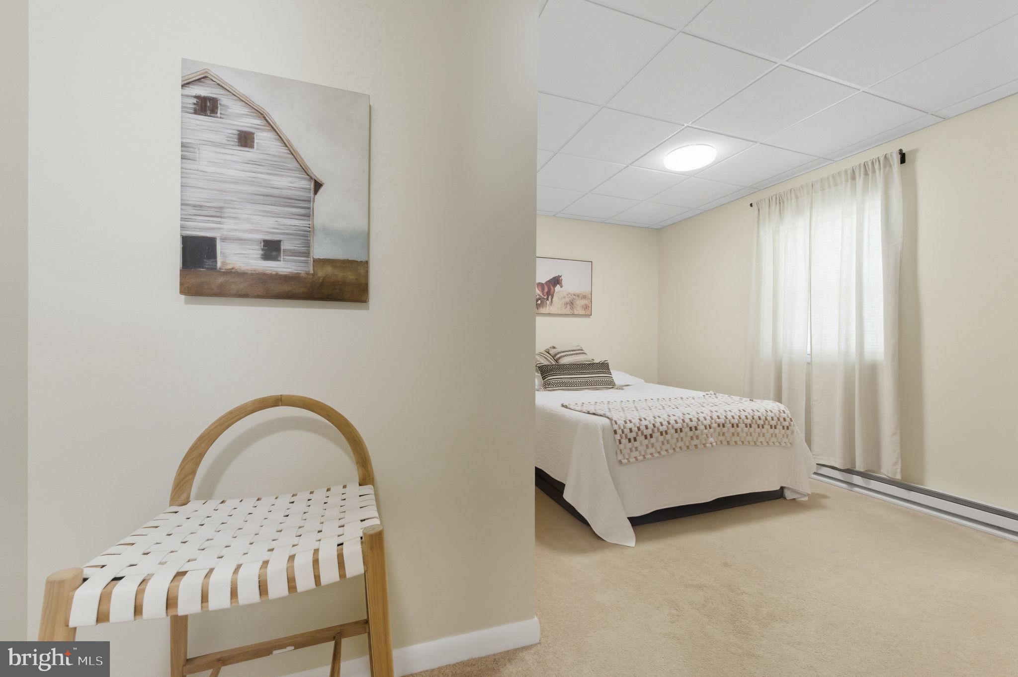 20949 Johnson Road Lincoln, DE 19960 - Photo 12 of 33 a bedroom with a bed and a painting on the wall