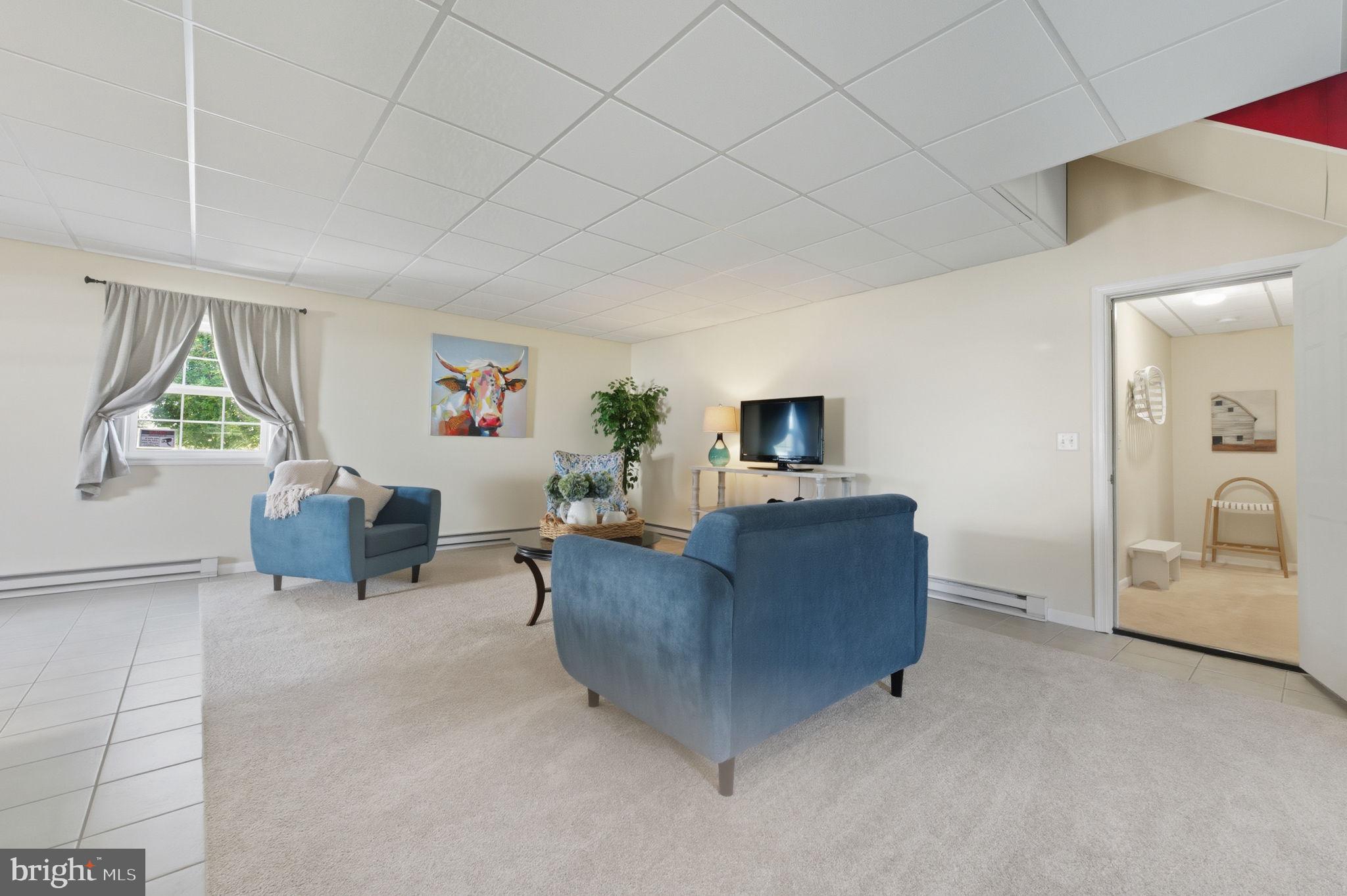 20949 Johnson Road Lincoln, DE 19960 - Photo 4 of 33 a living room with furniture and a flat screen tv
