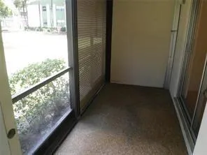 a view of a glass door and a window