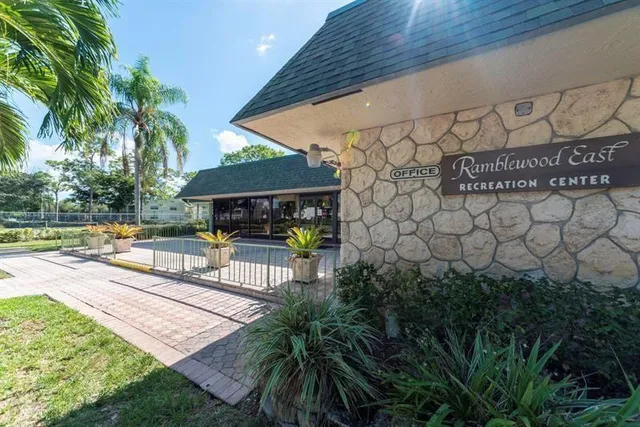 a view of a swimming pool with sitting area