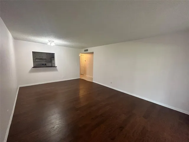 a view of a big room with wooden floor