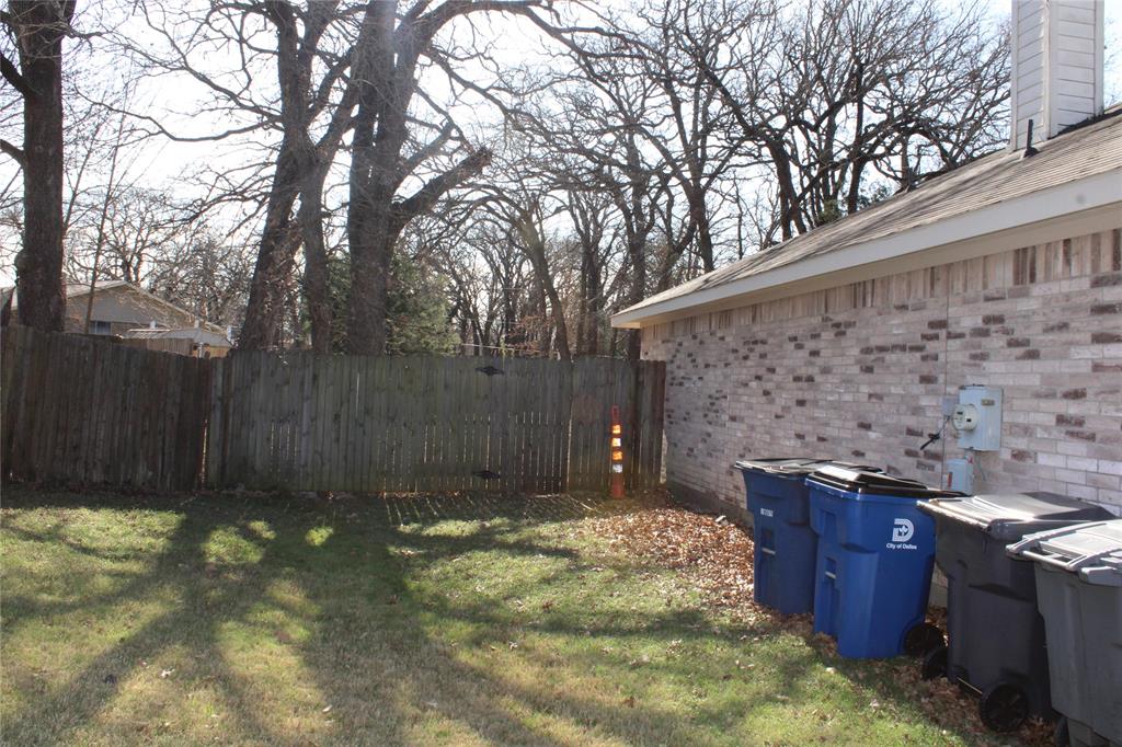 2136 Coelum Court Dallas, TX 75253 - Photo 25 of 29 a backyard of a house with wooden fence