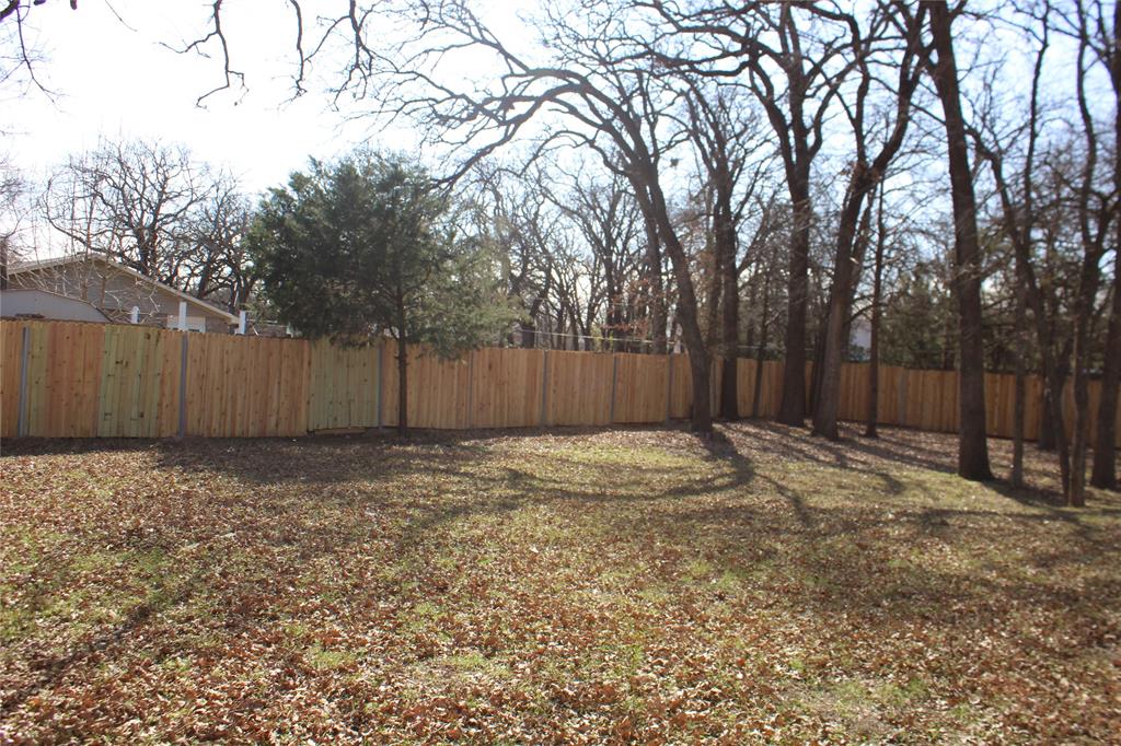 2136 Coelum Court Dallas, TX 75253 - Photo 27 of 29 a view of outdoor space with wooden fence