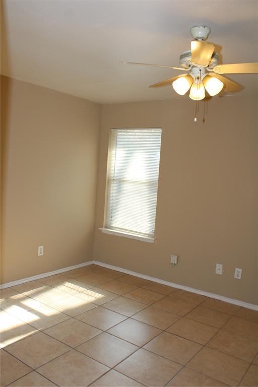 2136 Coelum Court Dallas, TX 75253 - Photo 6 of 29 a view of a room with window and wooden floor