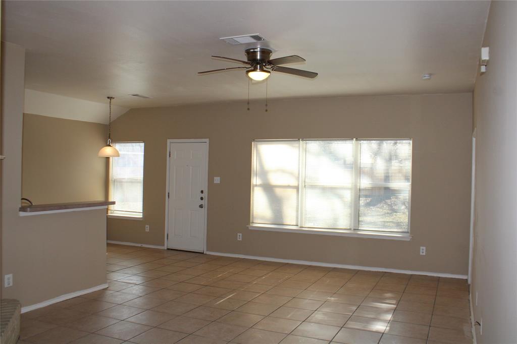 2136 Coelum Court Dallas, TX 75253 - Photo 7 of 29 a view of an empty room with a window