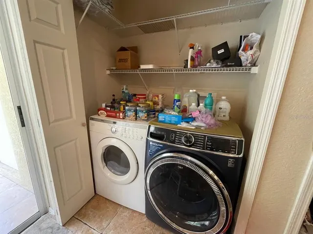 a utility room with dryer and washer
