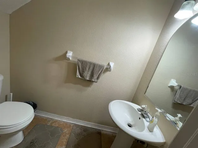 a bathroom with a sink and a toilet