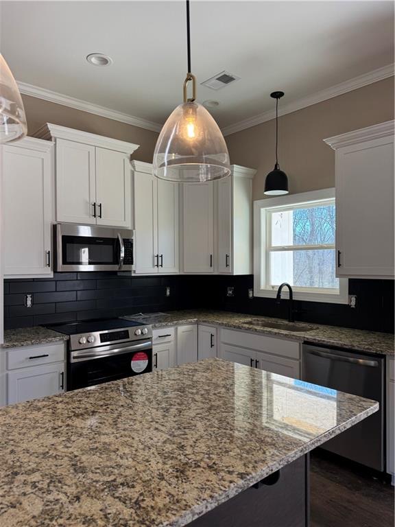 249 Wilson Road Temple, GA 30179 - Photo 3 of 13 a kitchen with stainless steel appliances granite countertop a sink a stove and a microwave