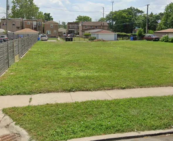 a view of a garden and houses