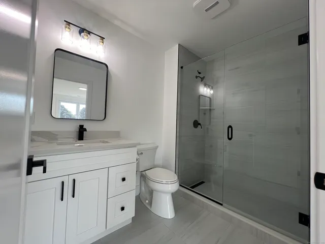 a kitchen with a sink cabinets and window