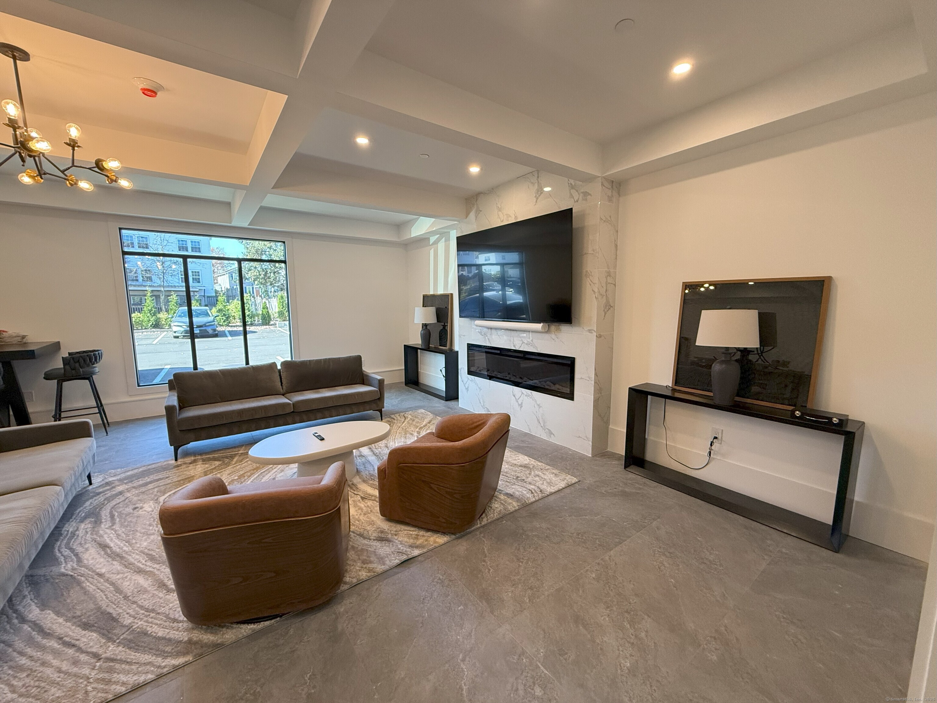 211 Ferry Boulevard, Unit 203 Stratford, CT 06615 - Photo 13 of 16 a living room with furniture and a flat screen tv