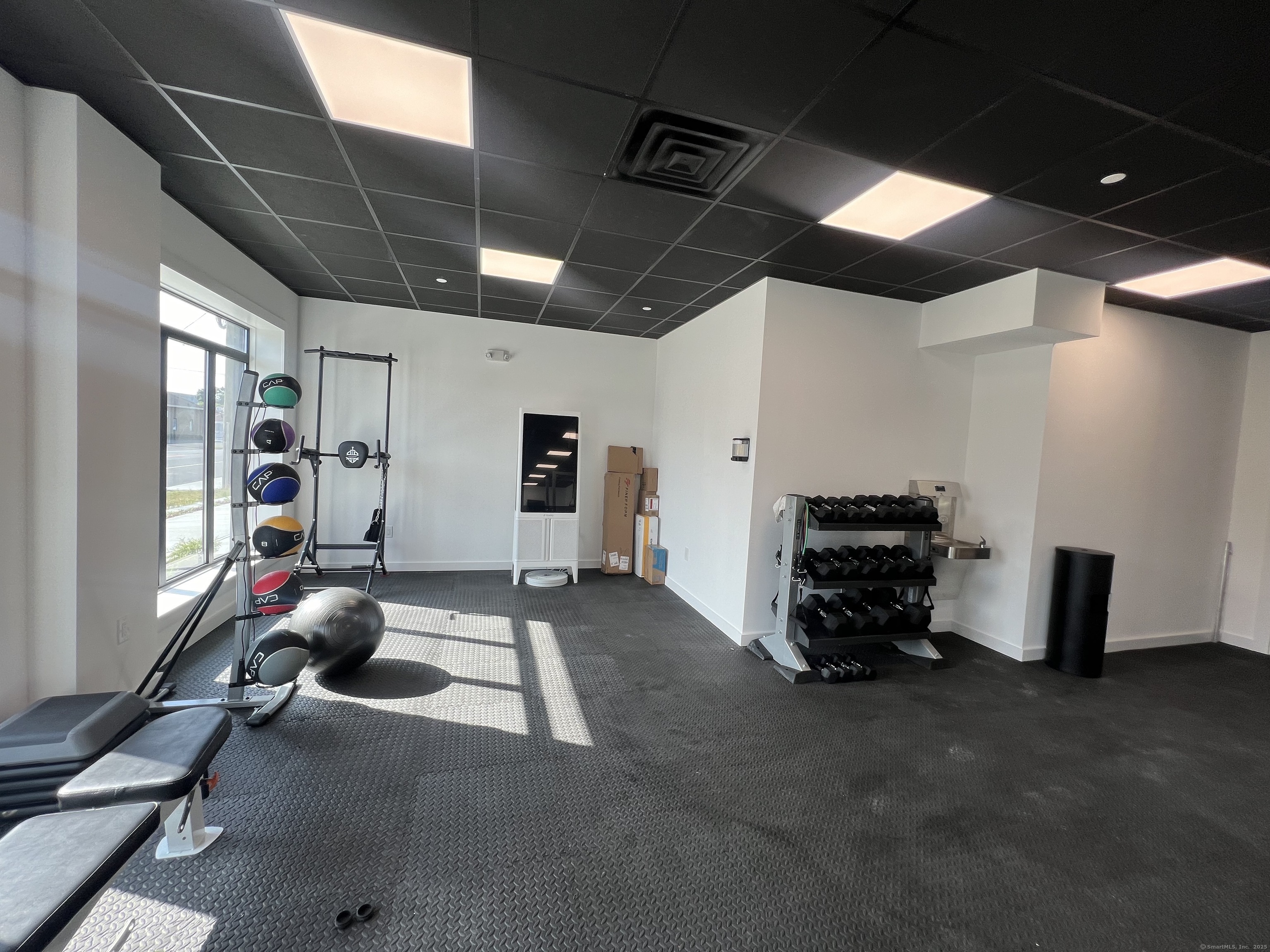 211 Ferry Boulevard, Unit 203 Stratford, CT 06615 - Photo 15 of 16 a view of a room with gym equipment