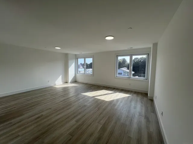 a bathroom with a double vanity sink toilet and shower