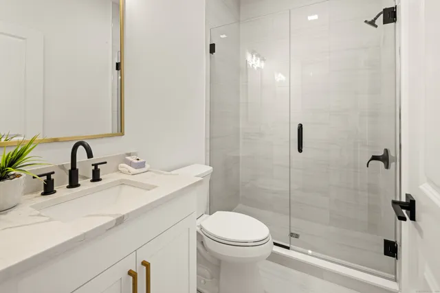 a bathroom with a toilet and shower