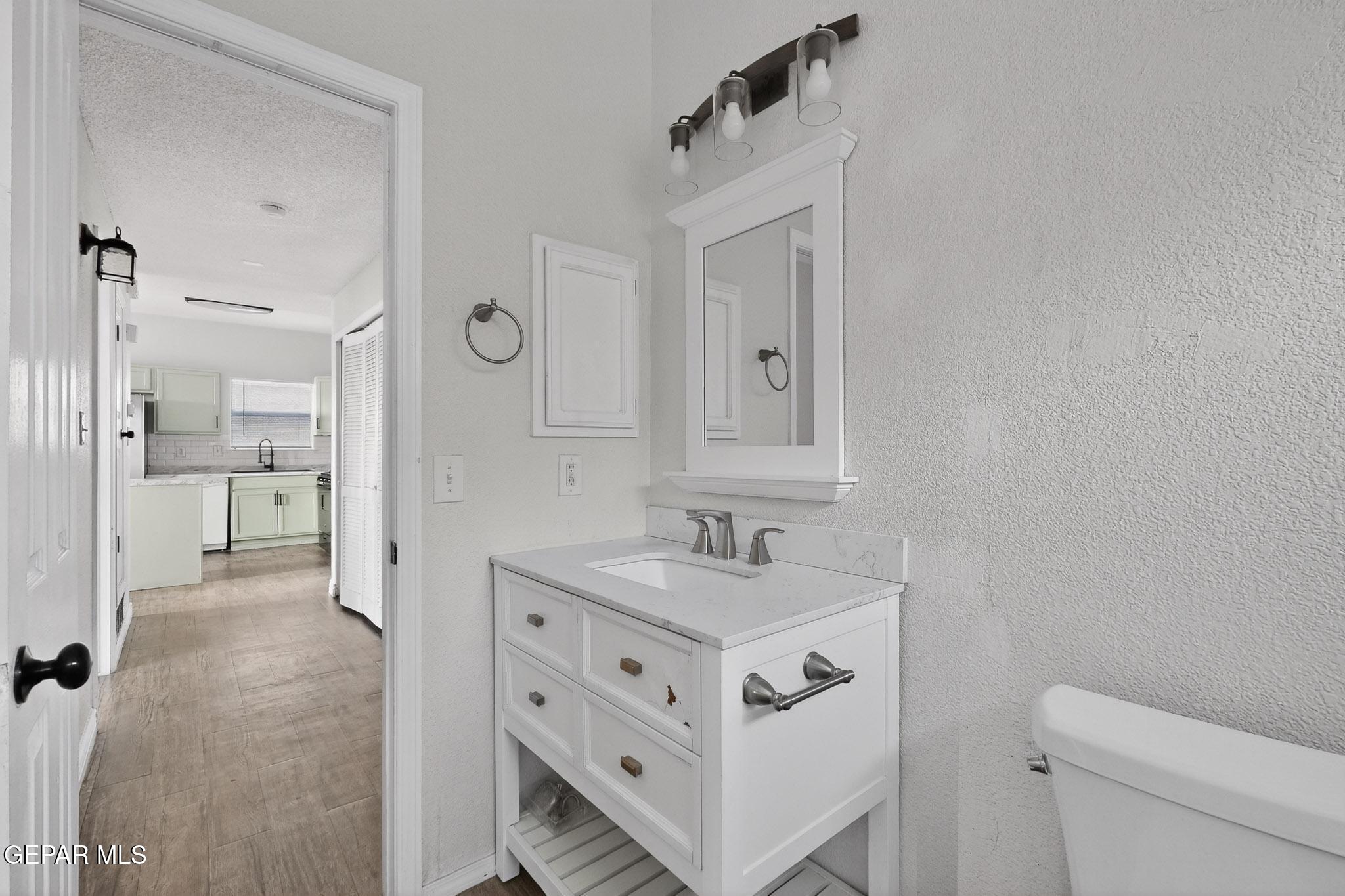 3626 Dominican Street El Paso, TX 79936 - Photo 13 of 20 a bathroom with a sink a toilet and shower